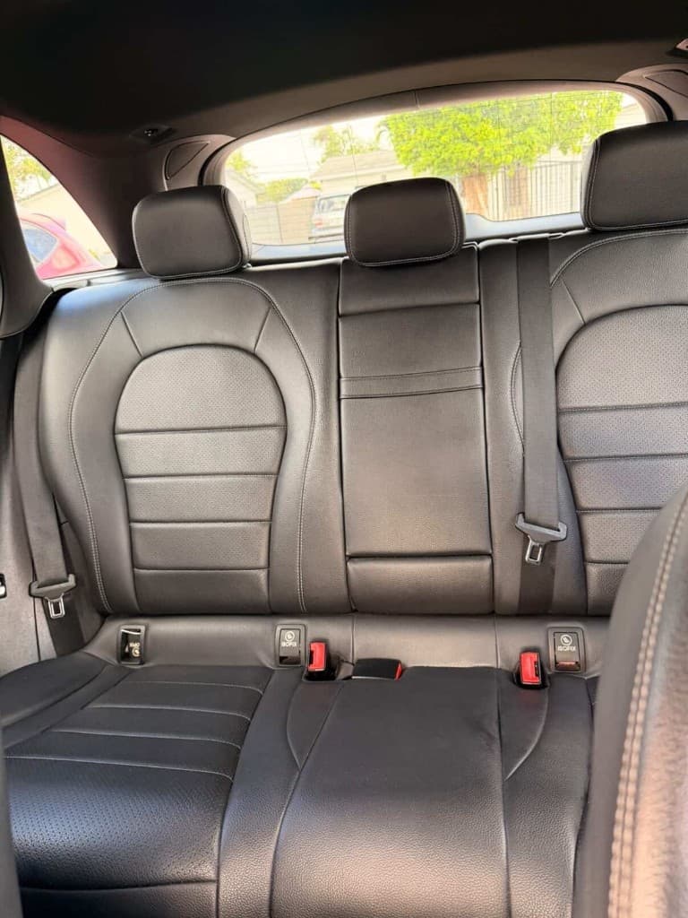 Rear bench seats with black leather upholstery