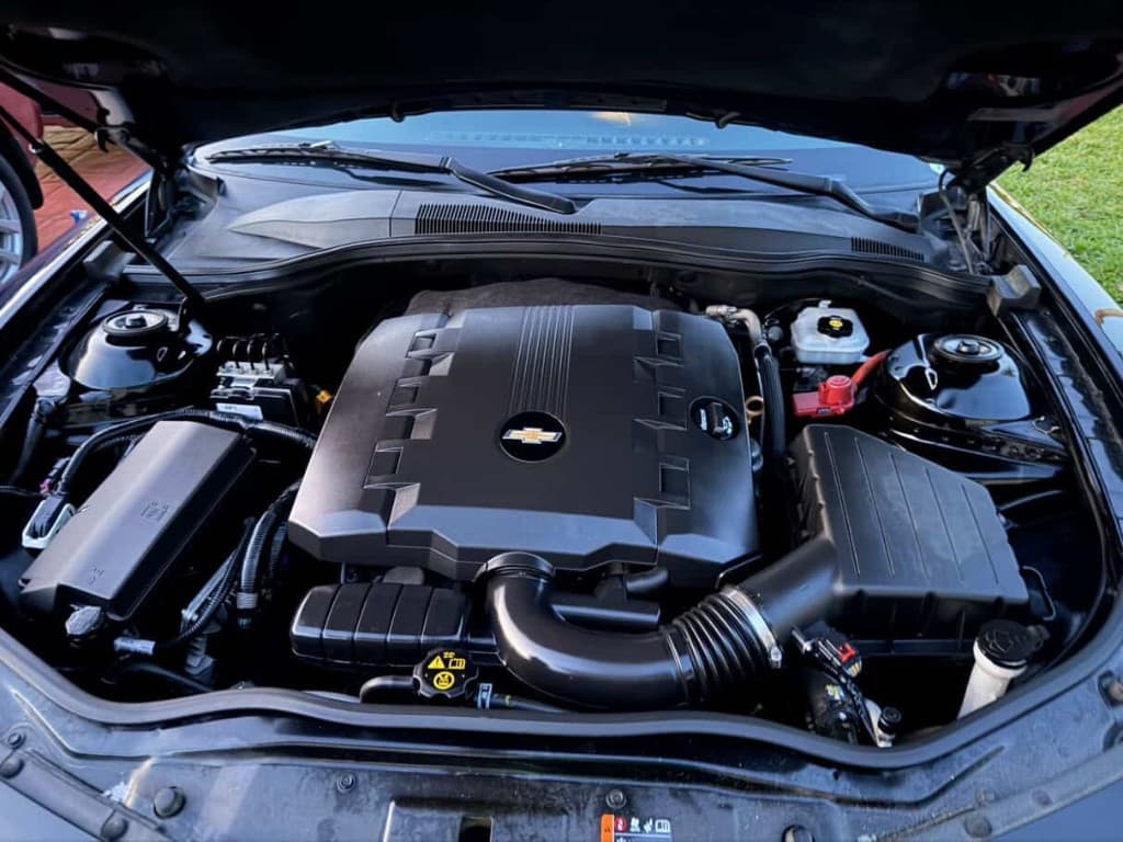 Clean detailed Chevrolet engine compartment with gold bowtie emblem